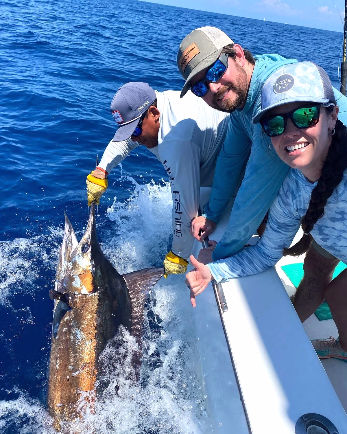 Marlin beside a Costa Rica offshore charter boat